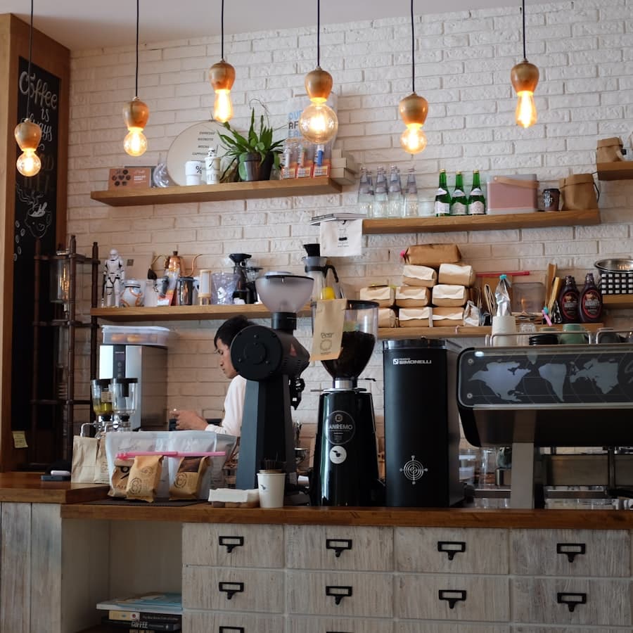 The espresso counter under a row of pendant lights