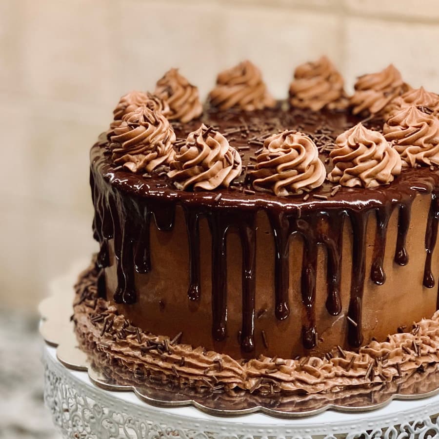 A chocolate layer cake finished with a ganache drip