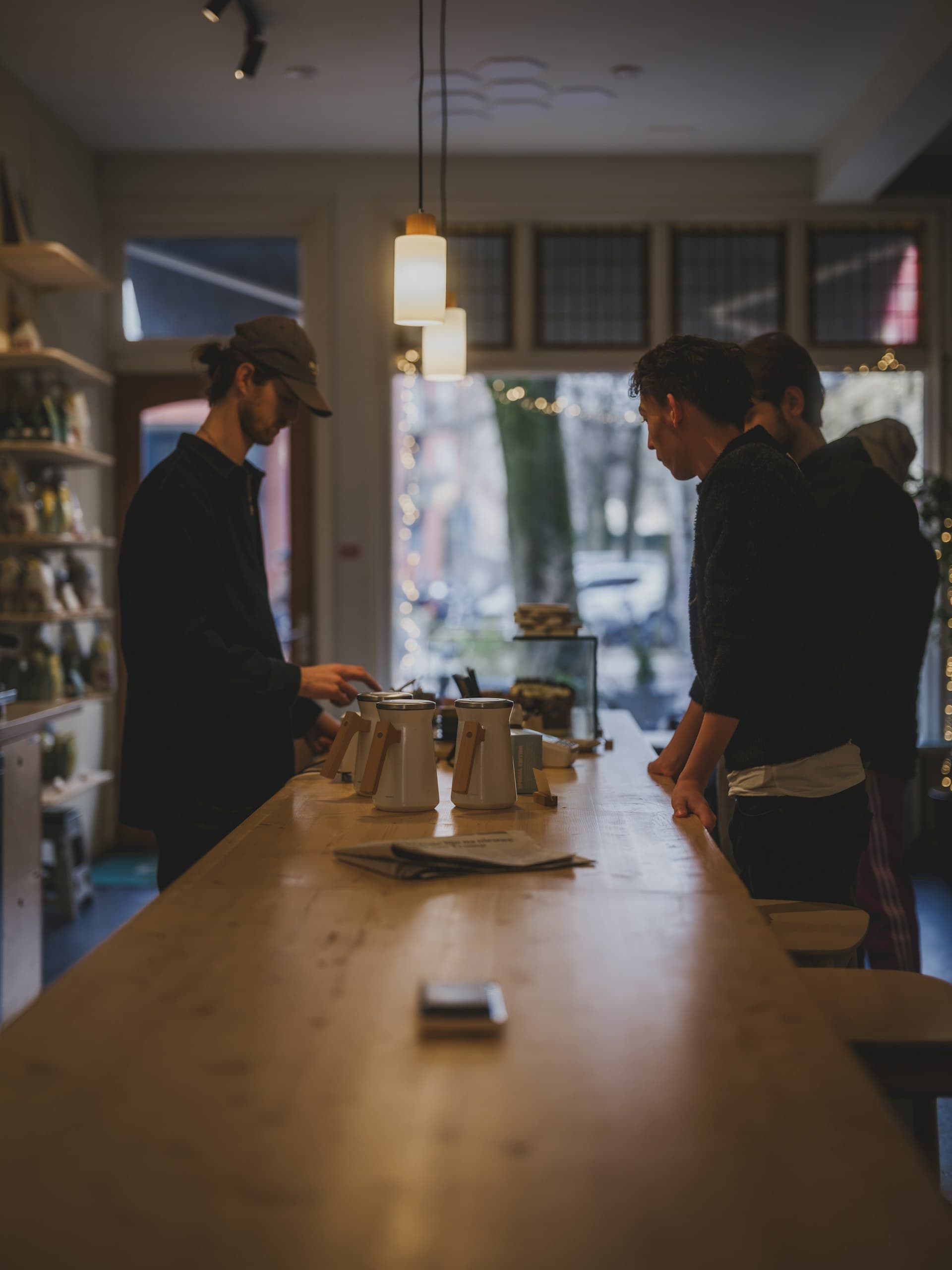 The warm interior of the Overtime café in the evening
